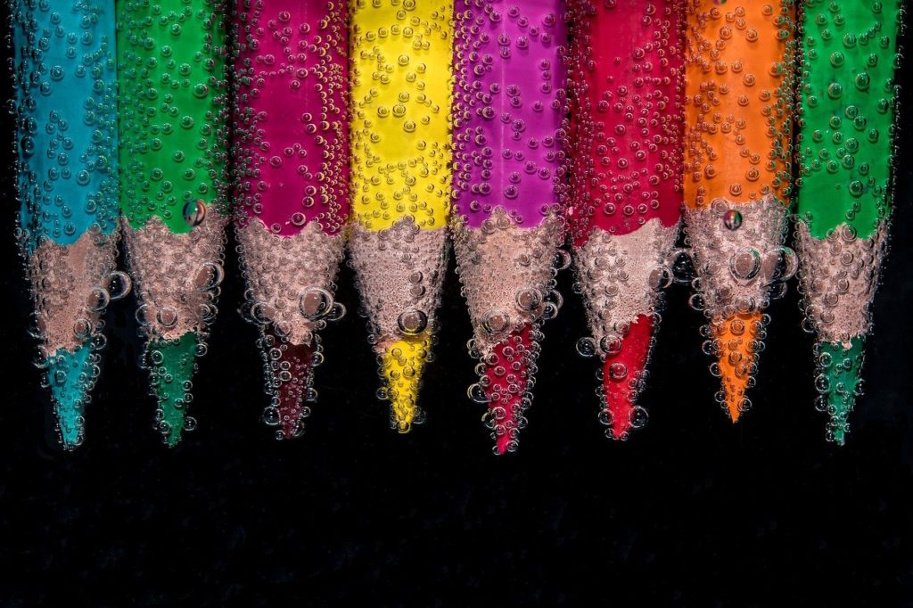 Coloured pencils dipped in water